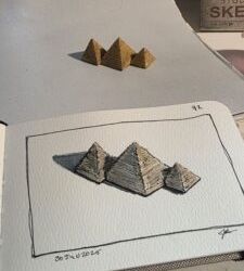 Miniature version of the Great Pyramids of Giza and an ink and watercolor wash sketch of them