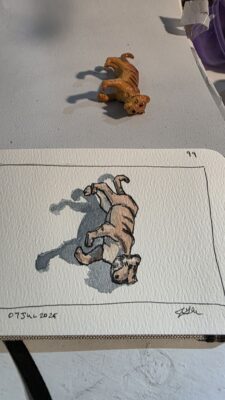 Toy tiger and an ink and wash watercolor sketch of it