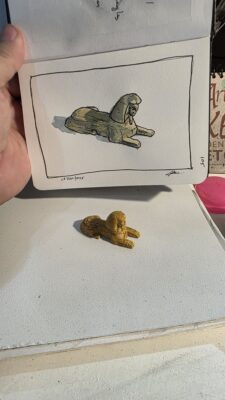 A model of The Sphinx and an ink and watercolor wash