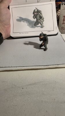 Miniature WWII Radio Operator model from Safari, Ltd., and an in and watercolor wash sketch