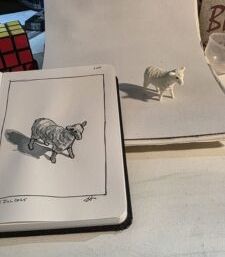 A miniature sheep model from Safari Ltd. and an ink and watercolor wash sketch