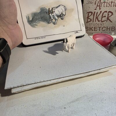 Mountain goat figurne and an ink and watercolor wash sketch